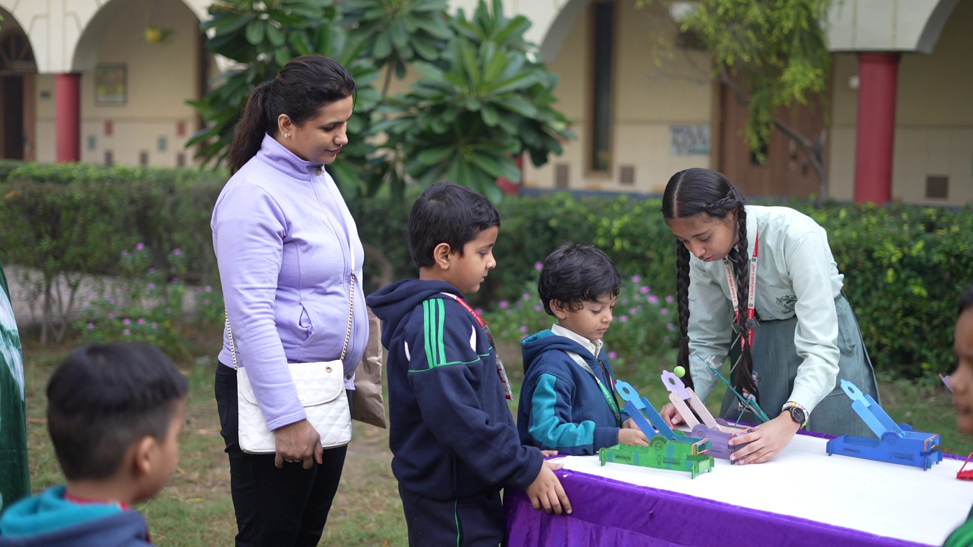 An AeroBay STEM educator guiding students through an aircraft activity